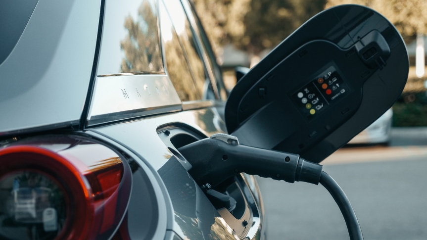 Charger plugged into electric vehicle