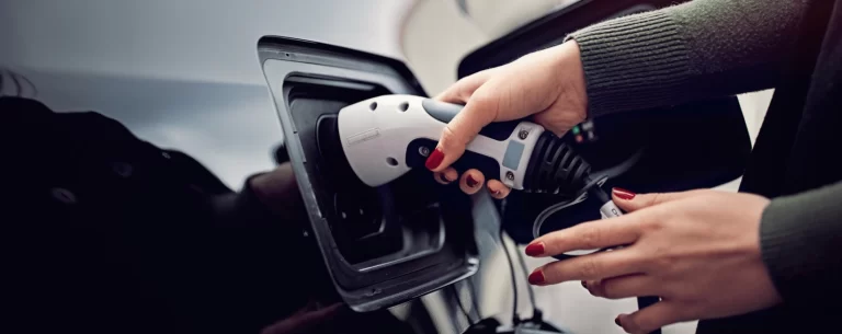 Woman charging a car