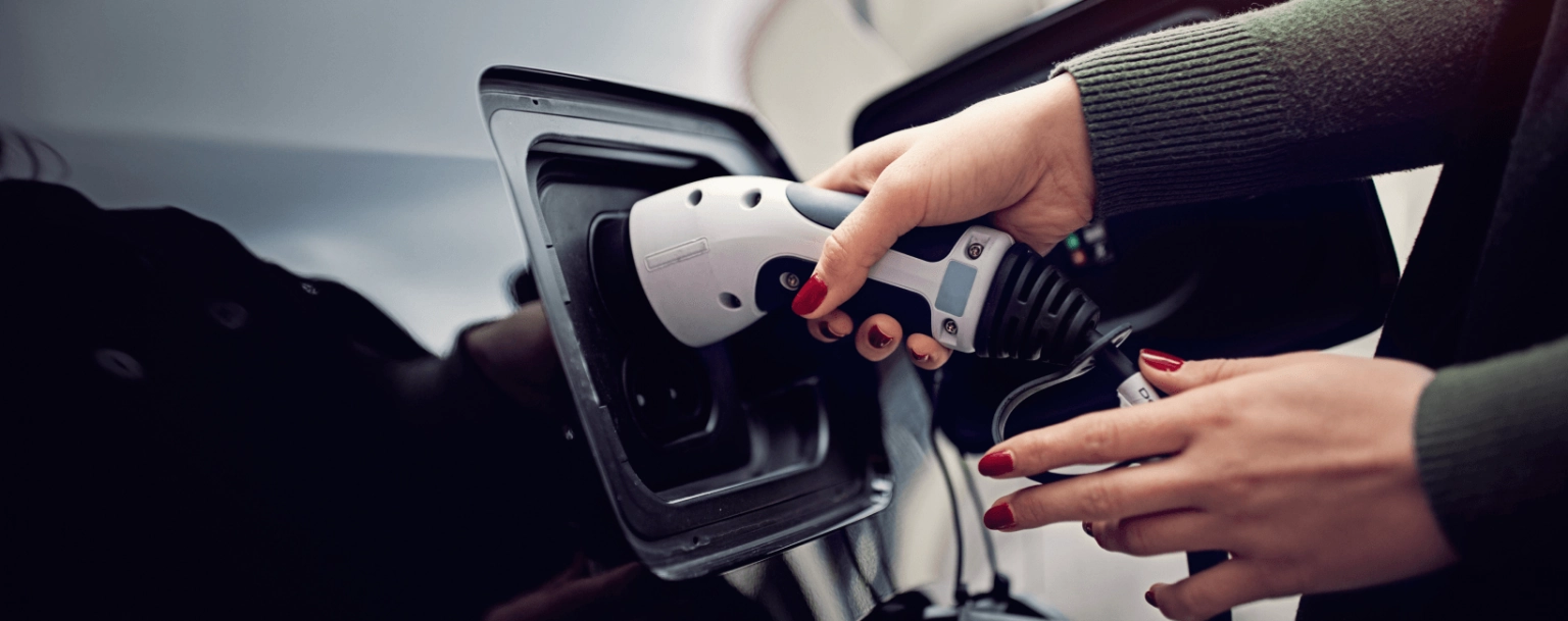Woman charging a car