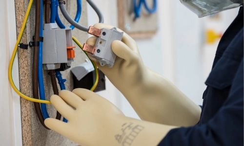 Image showing an electrician working on an installation