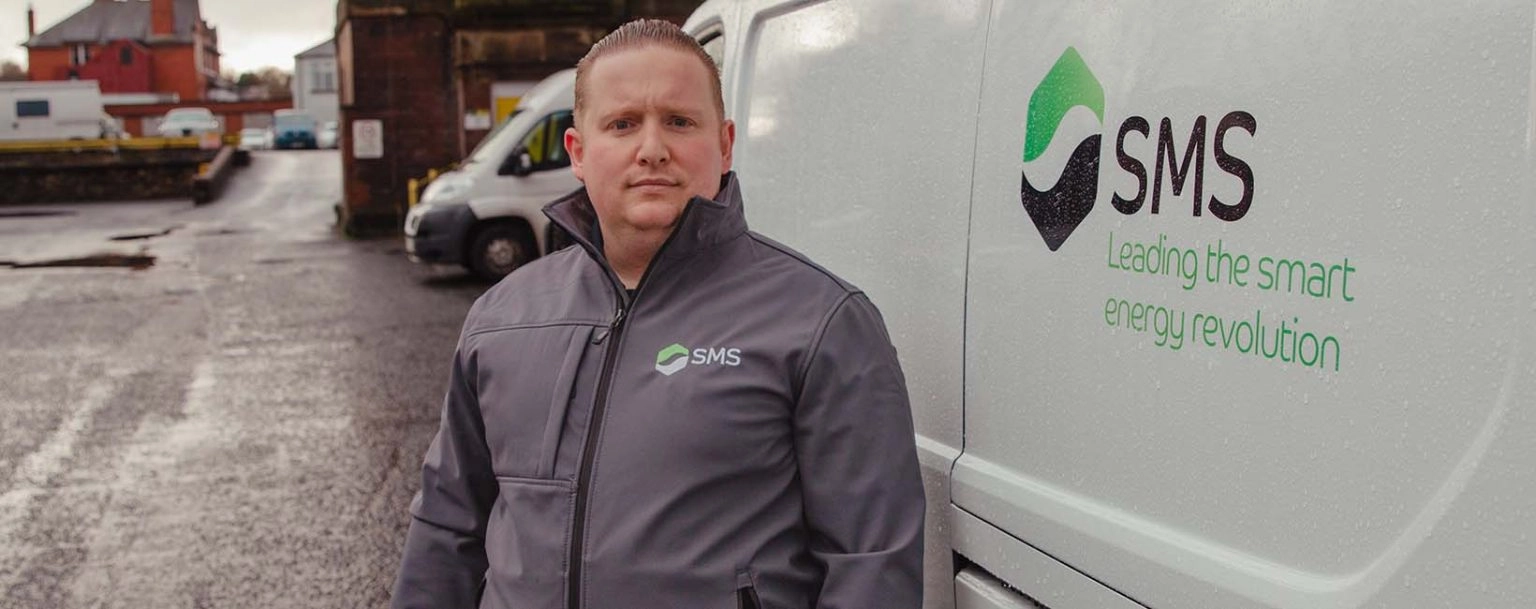 SMS engineer in front of a SMS van.